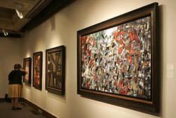 アラン・ドロン氏所蔵の絵画で、競売にかけられたリオペル作の「鳥の谷」(手前)(AP)